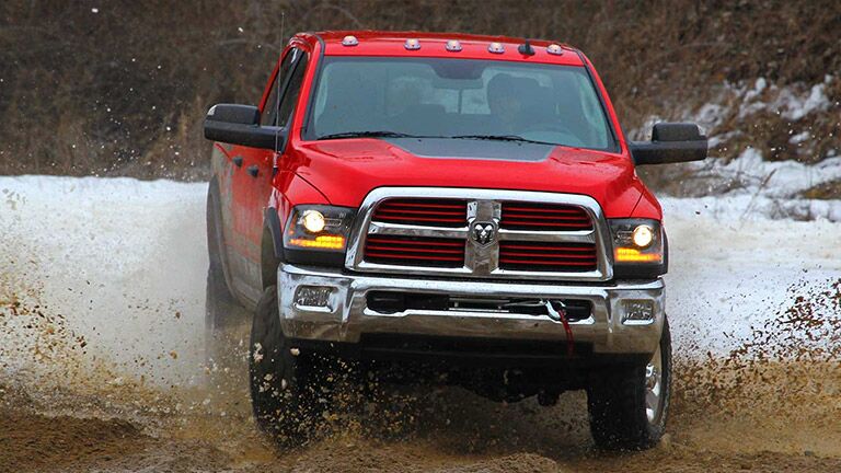 red 2016 Ram 2500 in the mud