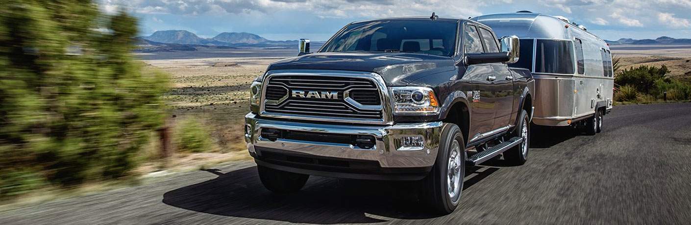 Black 2018 Ram 2500 towing trailer