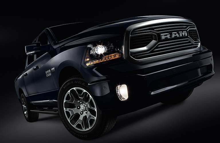 tilted view of the unique grille and wheel color of the 2018 Ram Limited Tungsten Edition