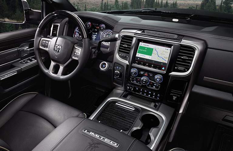 steering wheel and Uconnect system in the 2018 Ram 2500 Limited