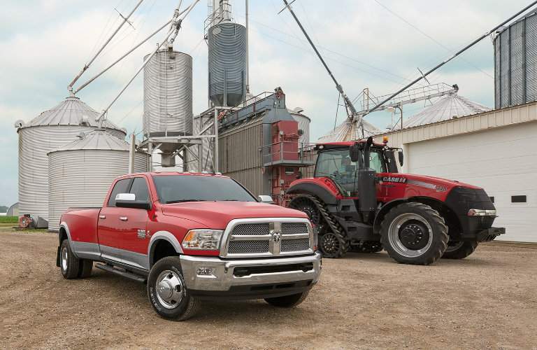 2018 Ram Harvest Edition in Case IH Red in front of a silo