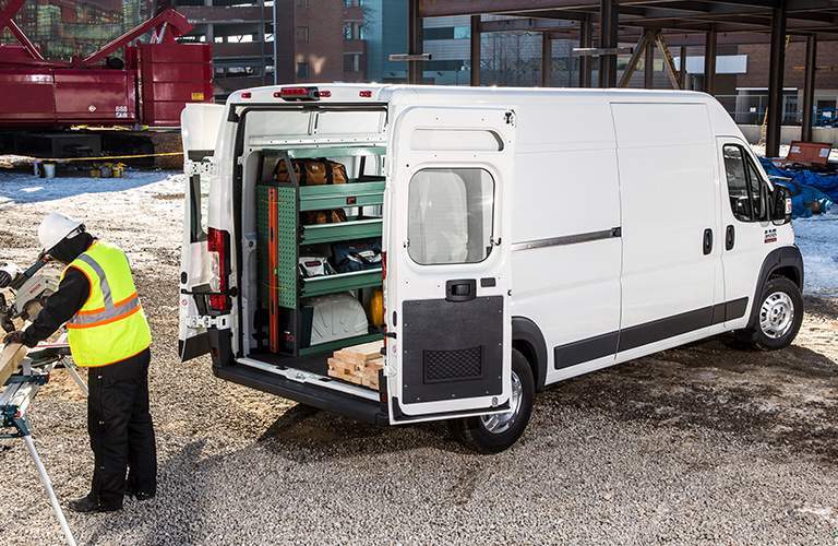 2018 Ram ProMaster Cargo Van with the rear doors open on a work site