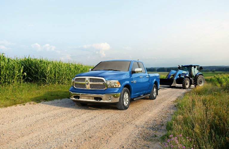 2018 Ram Harvest Edition in New Holland Blue parked in a cornfield