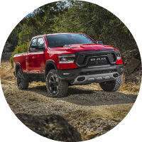 2019 Ram 1500 Rebel seen from the front and side in red