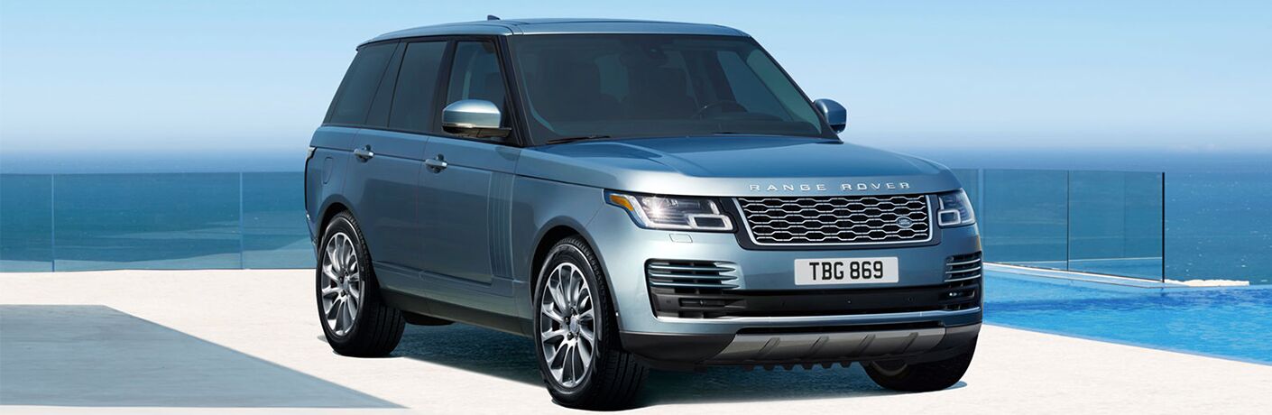 range rover suv in front of the waves range rover suv in front of the waves