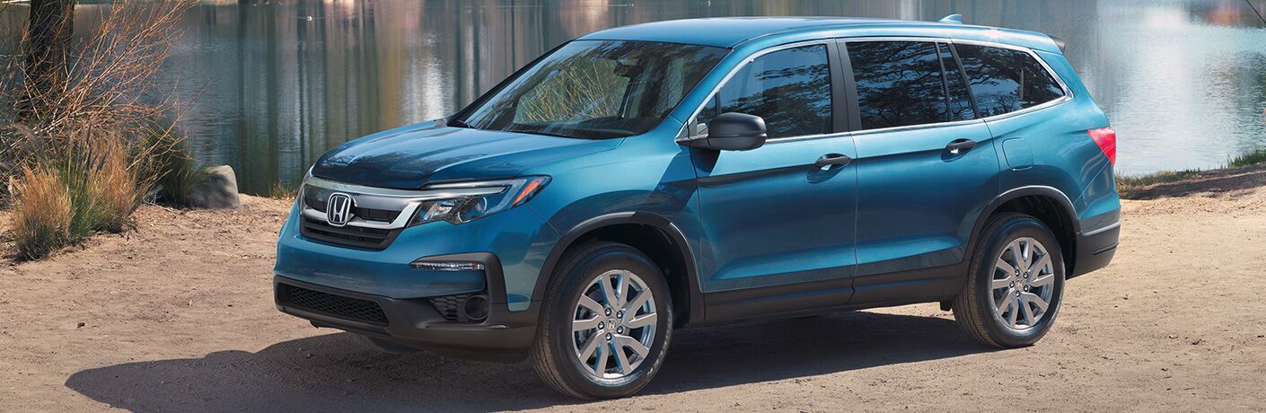 2020 Honda Pilot exterior front fascia and drivers side in front of lake