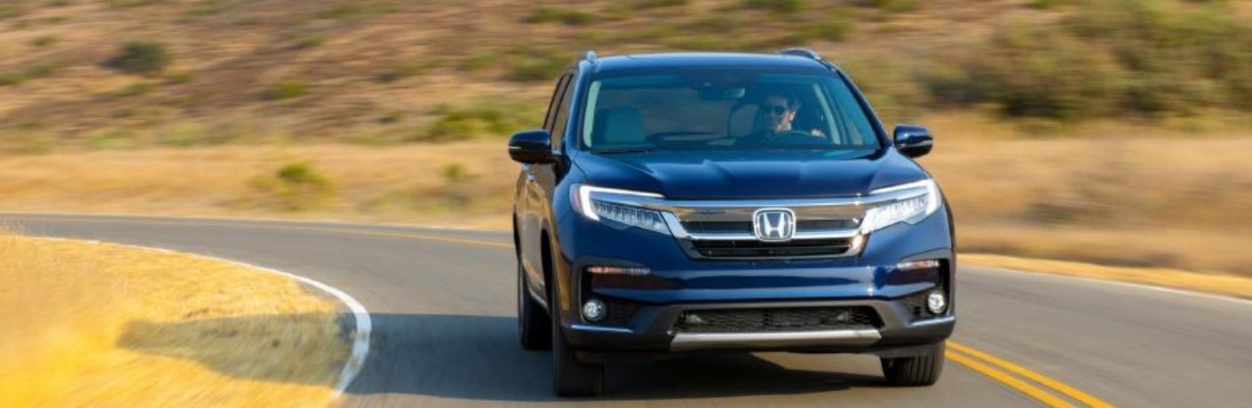 2022 Honda Pilot Blue driving on the road