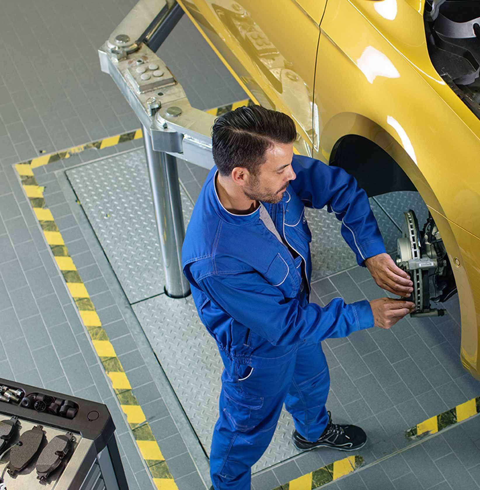 100+ point inspection Mechanic working on car