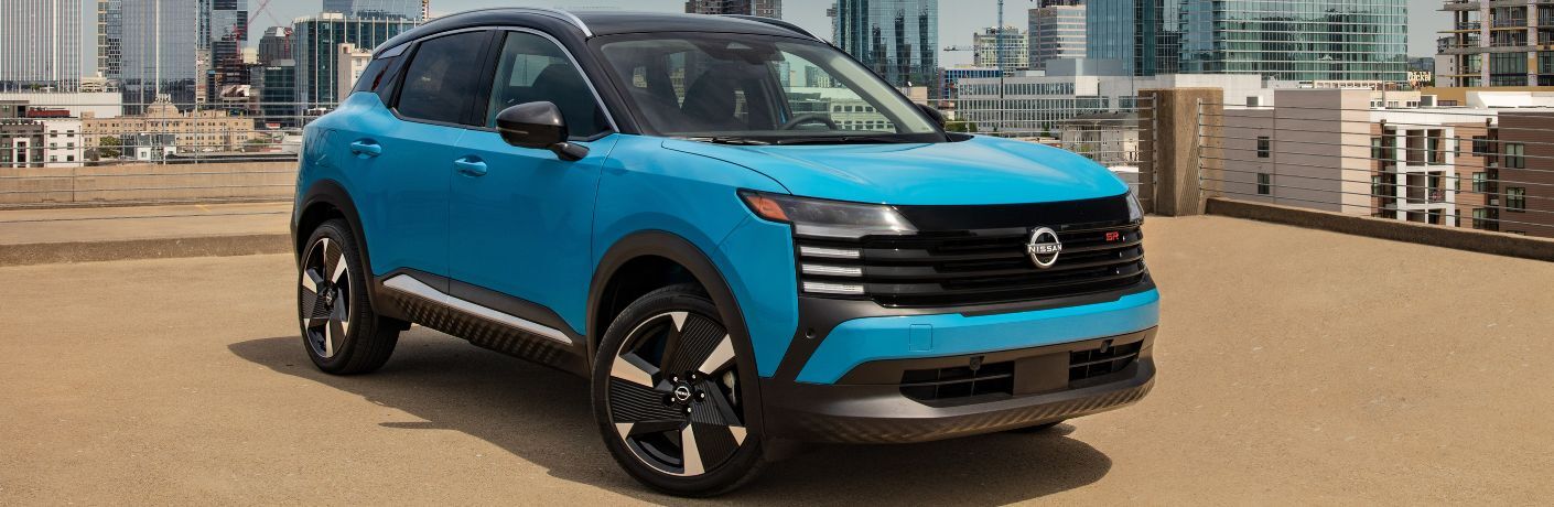 2025 Nissan Kicks in blue in a city
