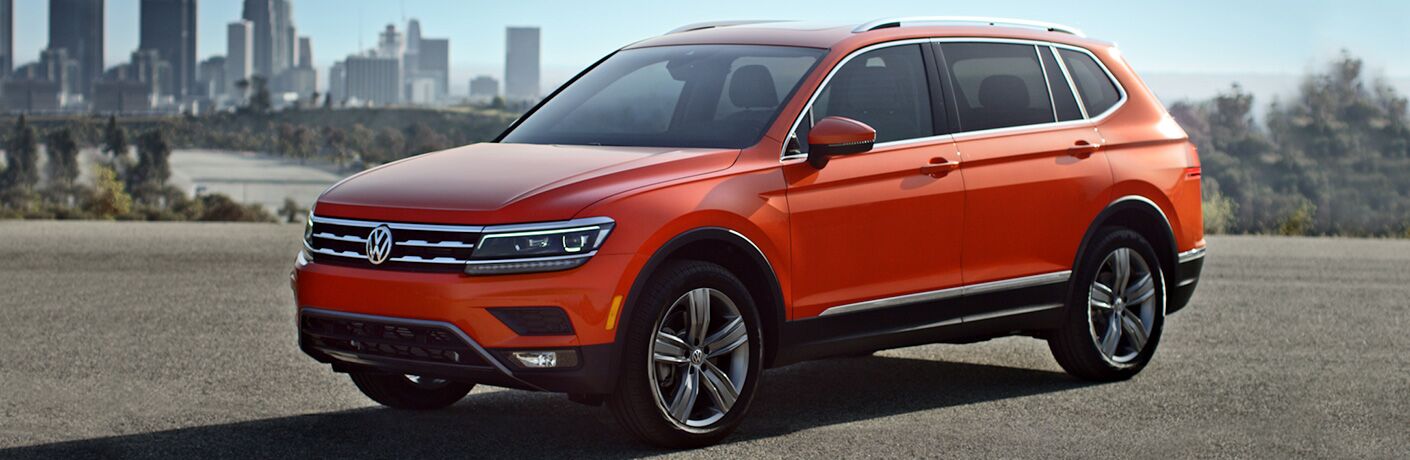 2018 Volkswagen Tiguan parked on gravel with city in background