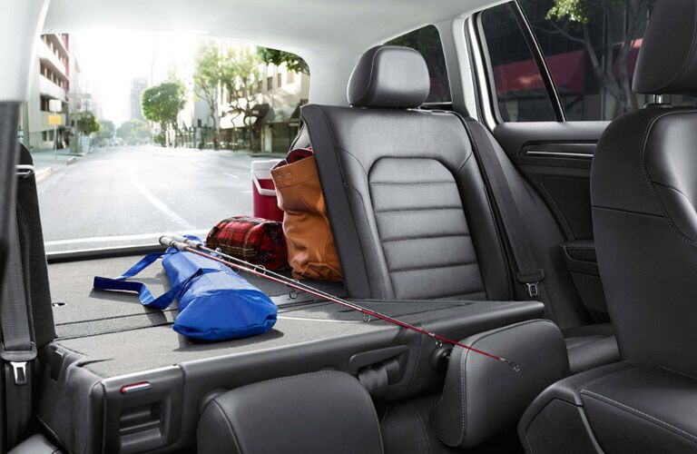 View of the 2017 Volkswagen Golf SportWagen's cargo space, with seats folded, from the passenger seat