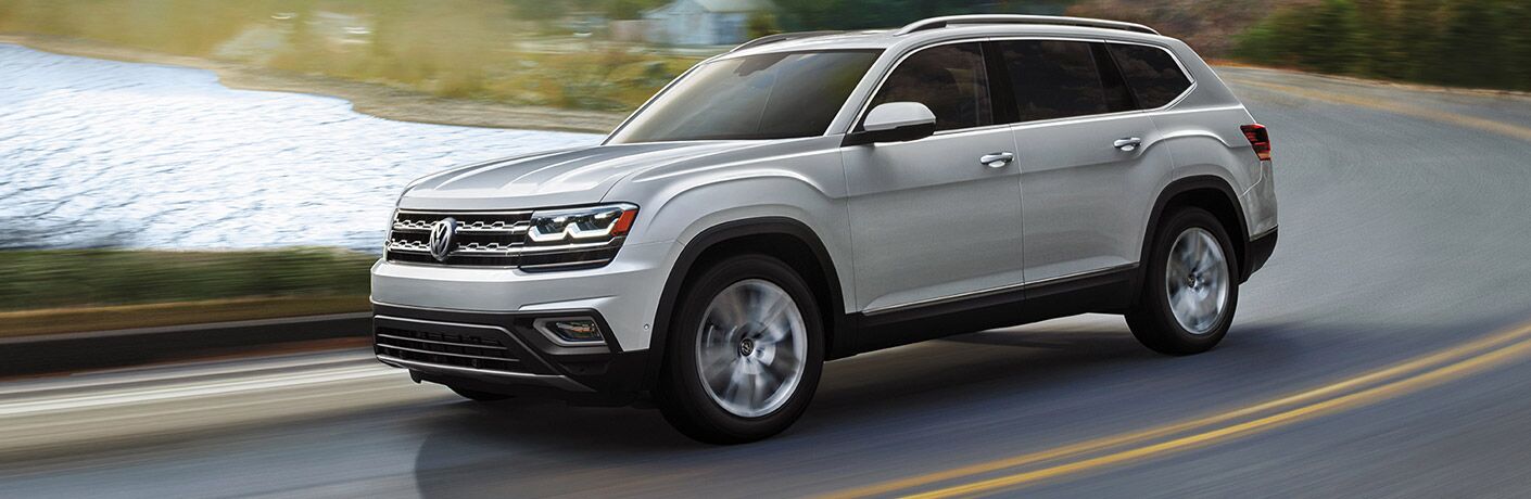 2019 Volkswagen Atlas full view driving on winding road