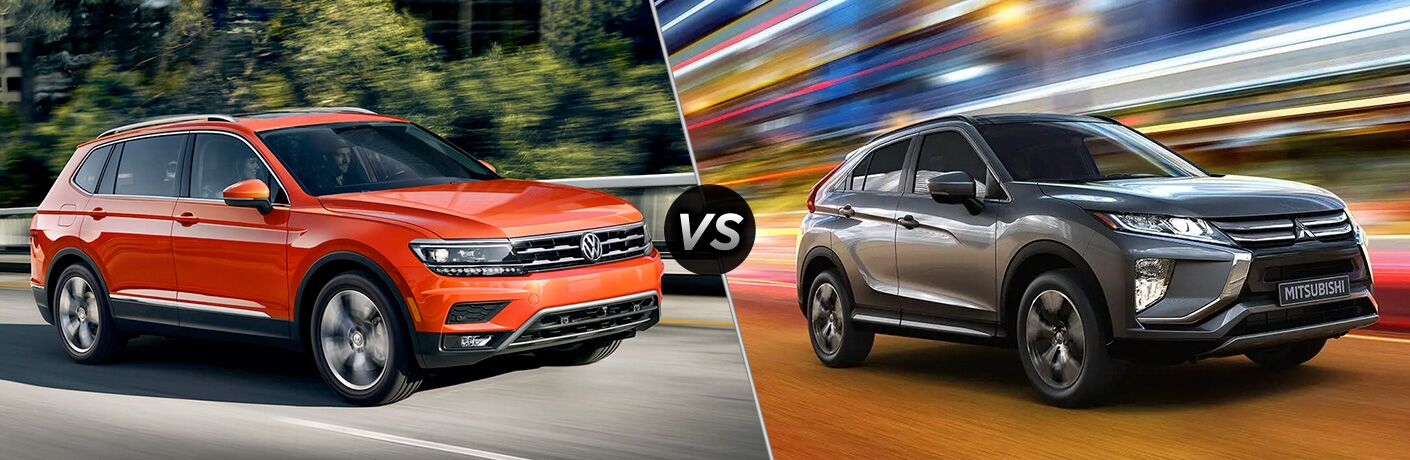 Front passenger angle of an orange 2019 Volkswagen Tiguan on left VS front passenger angle of a grey 2019 Mitsubishi Eclipse Cross on right