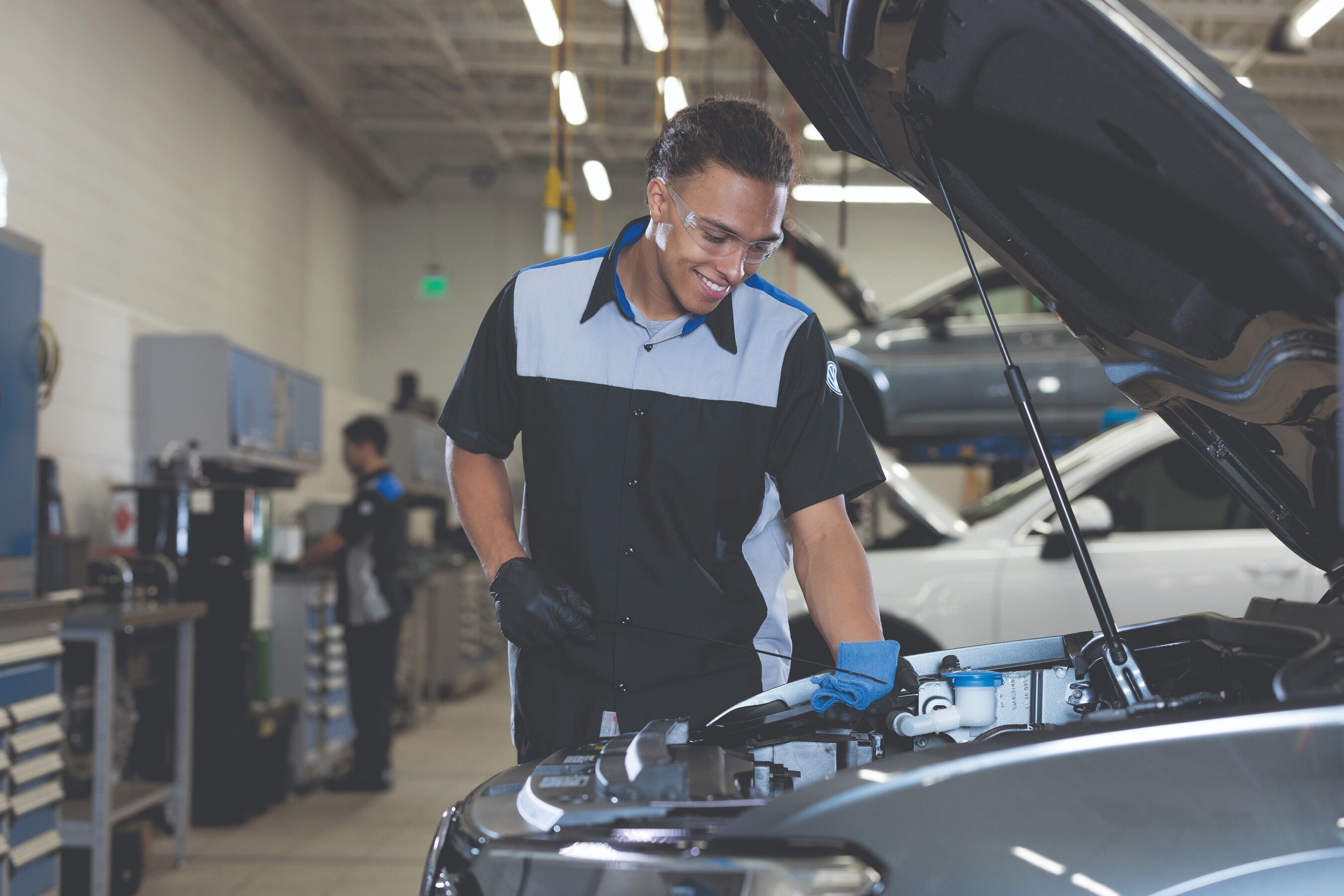service technician using dipstick service technician using dipstick