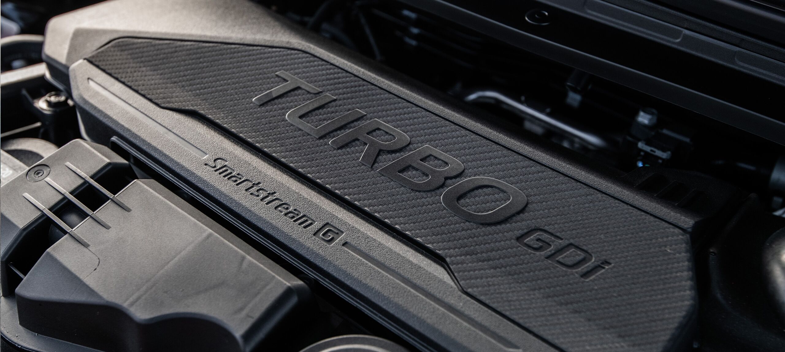 2026 Kia K4 Hatchback close up of the turbocharged engine