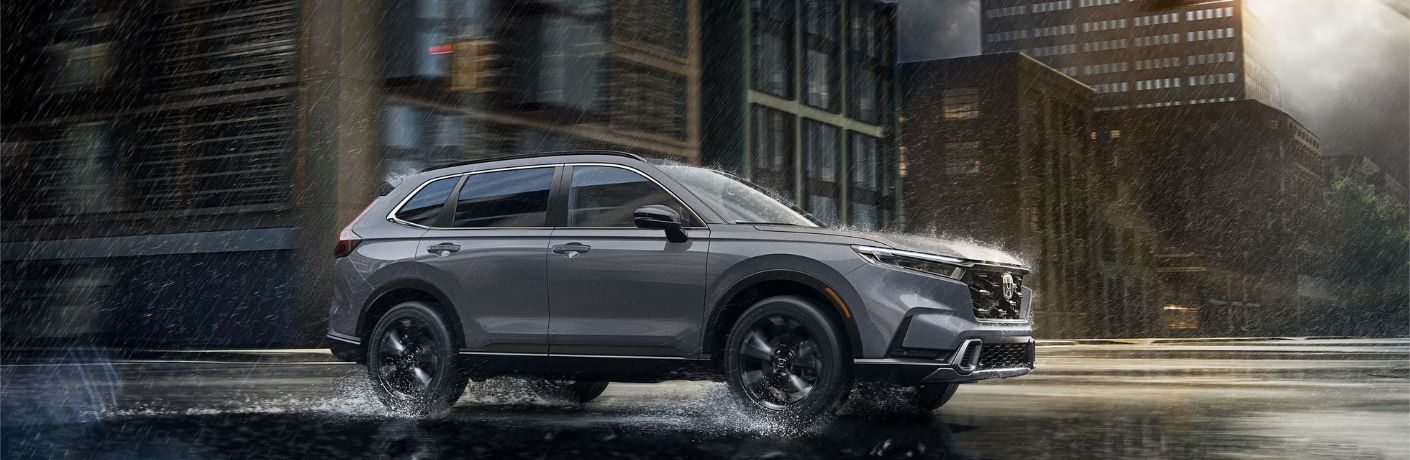2026 Honda CR-V Sport Touring Hybrid driving in the rain