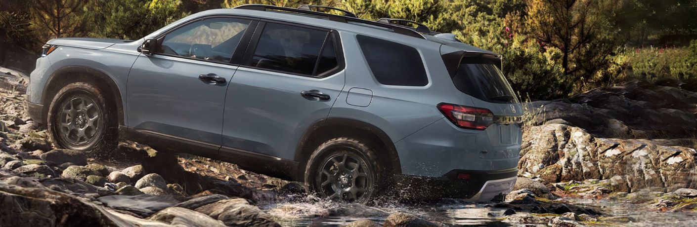 side view of the 2025 Honda Pilot navigating water