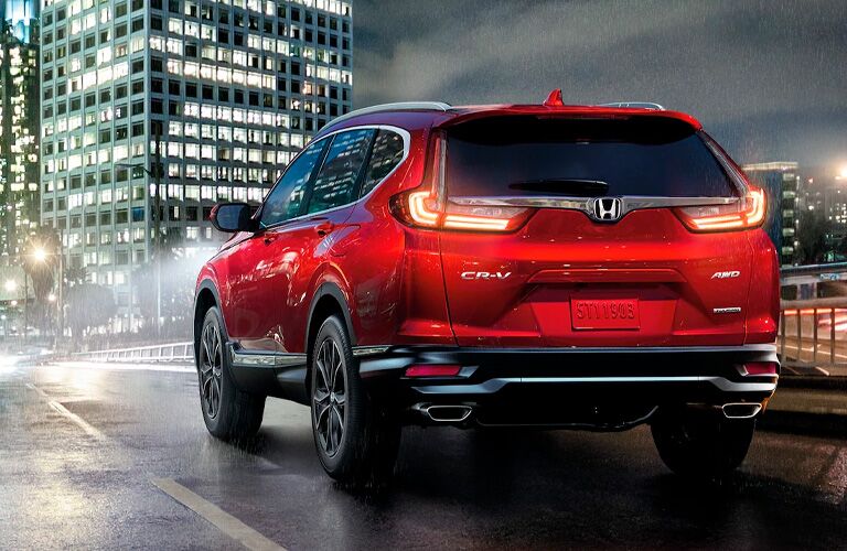 2021 Honda CR-V driving down a city street at night 2021 Honda CR-V driving down a city street at night