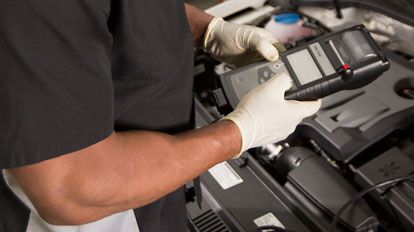 Volkswagen Care Plus Plan Details Volkswagen mechanic using code reading scanner
