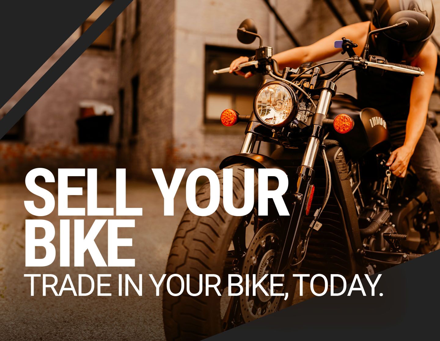 person on motorcycle touching the side of the bike