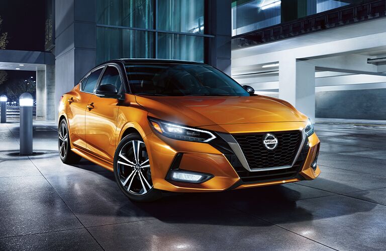 2021 Nissan Sentra parked in front of a building 2021 Nissan Sentra parked in front of a building