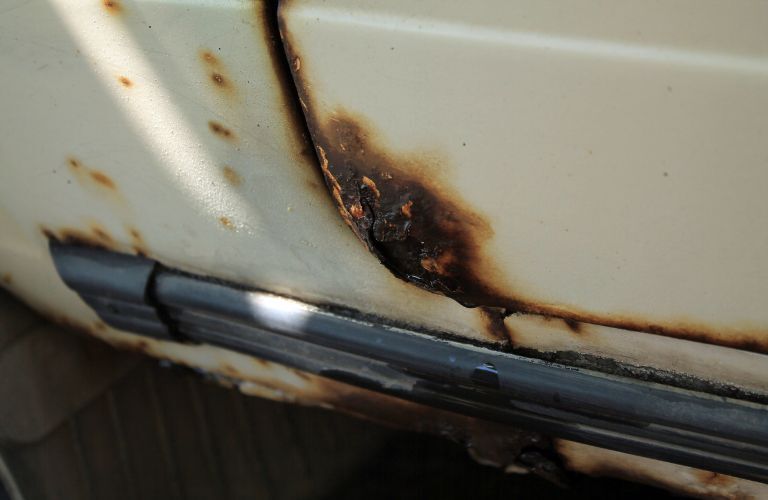 representative image of rust on a car