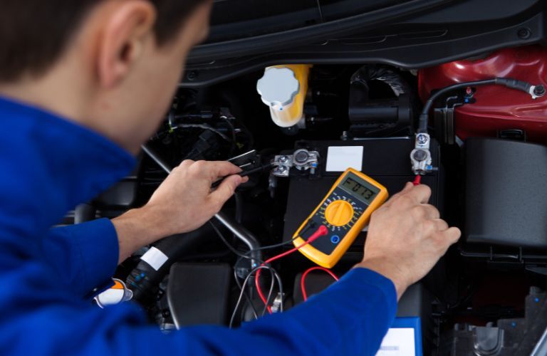technician testing a battery