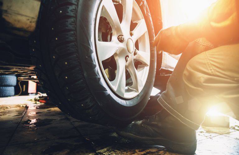Tire balancing being undertaken at a service center