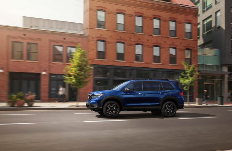 Side View of the 2024 Honda Passport on the road
