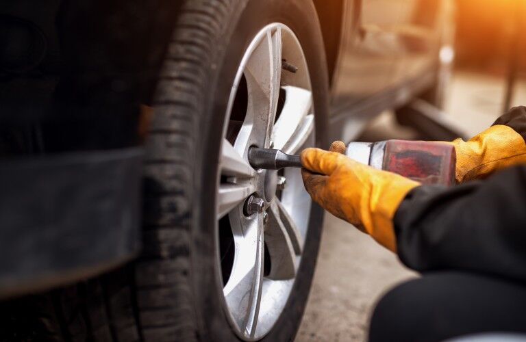 Mechanic replacing a tire Mechanic replacing a tire