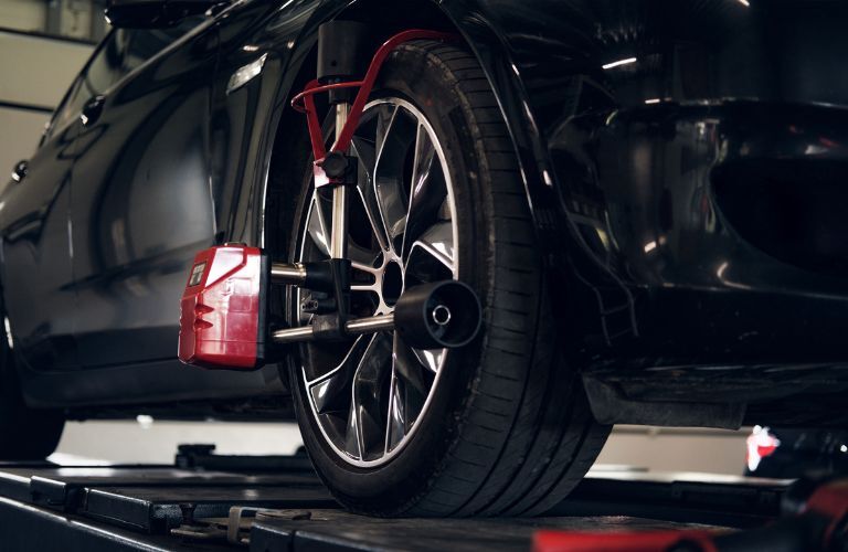 Tire balancing being undertaken at a service center