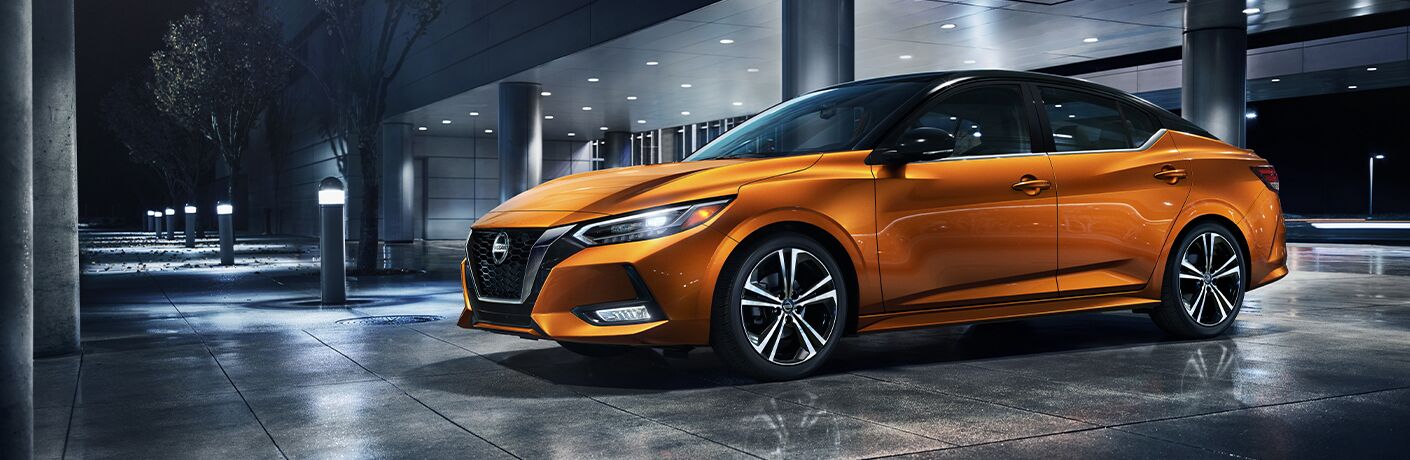 2021 Nissan Sentra parked in front of a building 2021 Nissan Sentra parked in front of a building