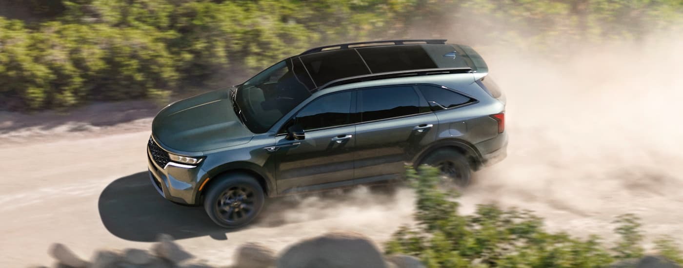 Green 2022 Kia Sorento X-Line driving off-road.