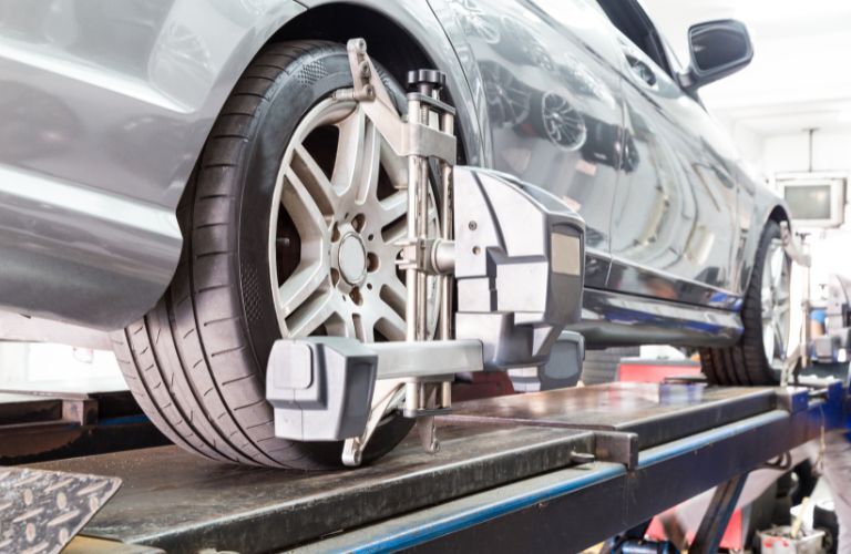 Wheel alignment being undertaken at a service center