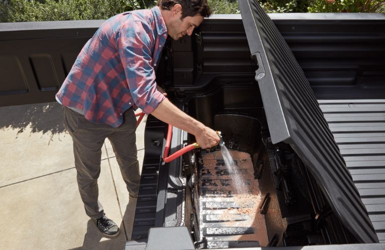 man cleaning under the bed of 2025 Honda Ridgeline