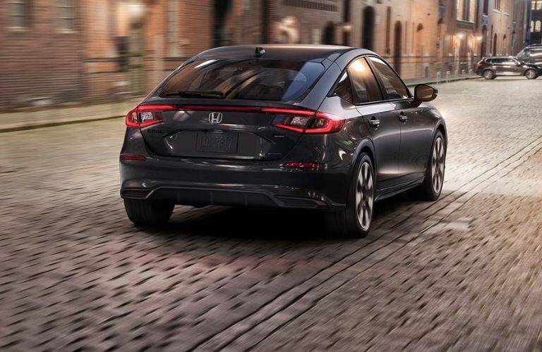 Rear view of the 2026 Honda Civic Hatchback Sport Touring Hybrid Black