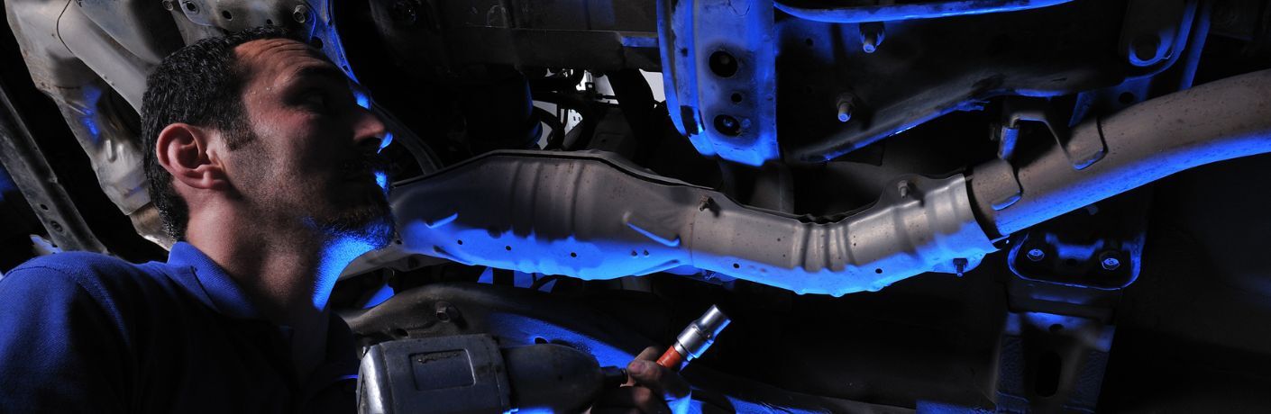 Technician checking under the vehicle