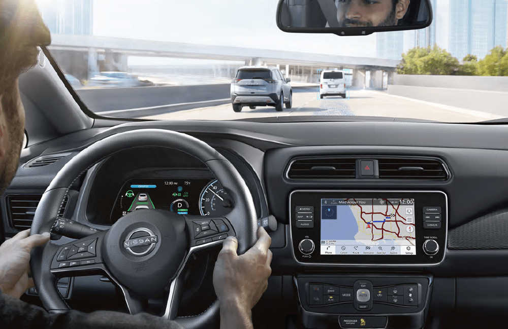 Man driving in Nissan EV Man driving in Nissan EV