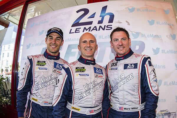 three race car drivers