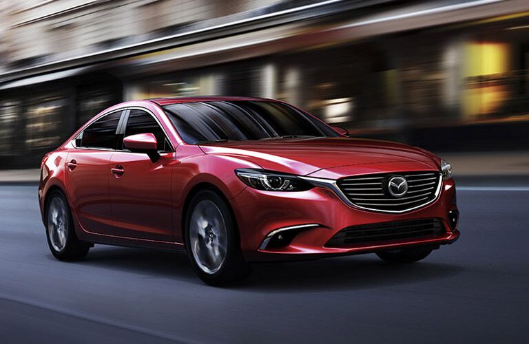 Mazda Mazda6 midsize sedan in red on the city streets