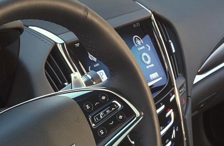 steering wheel and view of the CUE in the 2016 Cadillac ATS Alexandria MN
