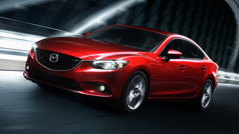 Red Mazda 6 driving