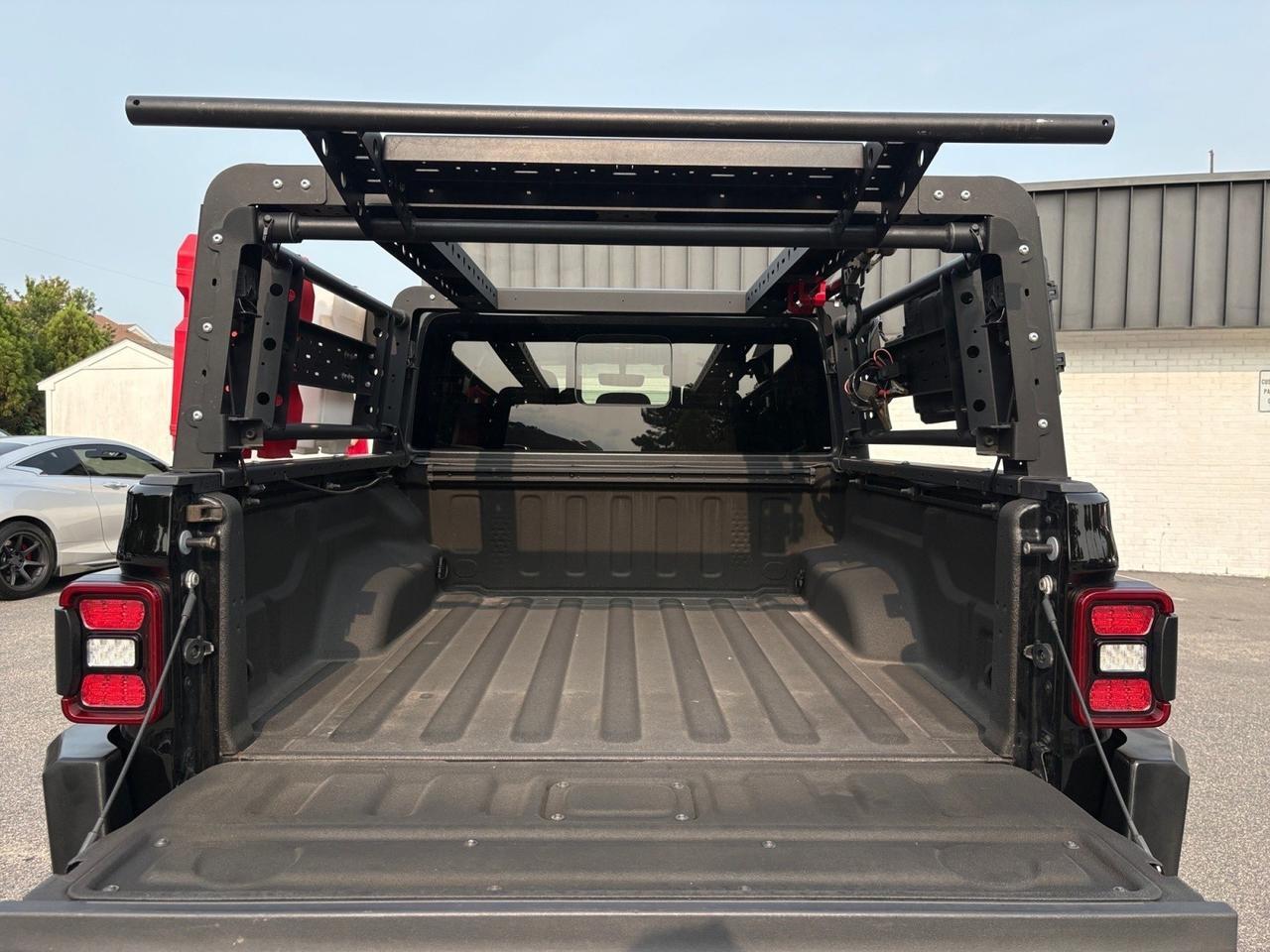 2020 Jeep Gladiator Mojave, BED RACK W/ FUEL & WATER MOUNTS, AUTO START/STOP, PUSH BUTTON START, UCONNECT SYSTEM, NAVIGATION, APPLE CARPLAY/ANDROID AUTO, BACKUP CAMERA WITH PARKING SENSORS, LOW MILEAGE, CLEAN CARFAX, THIS JEEP IS READY TO RIDE! Virginia Beach VA 2020 Jeep Gladiator Mojave, BED RACK W/ FUEL & WATER MOUNTS, AUTO START/STOP, PUSH BUTTON START, UCONNECT SYSTEM, NAVIGATION, APPLE CARPLAY/ANDROID AUTO, BACKUP CAMERA WITH PARKING SENSORS, LOW MILEAGE, CLEAN CARFAX, THIS JEEP IS READY TO RIDE! Virginia Beach VA