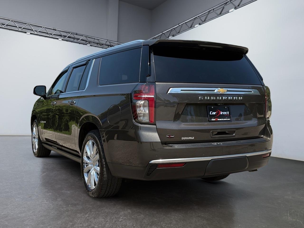2021 Chevrolet Suburban High Country, HEADS-UP DISPLAY, POWER RUNNING BOARDS, POWER LIFTGATE, BLIND SPOT ALERT, LANE KEEP ASSIST, PANORAMIC MOONROOF, APPLE CARPLAY/ANDROID AUTO, 360 BACKUP CAMERA, HEATED & COOLING SEATS, REAR DVD ENTERTAINMENT, LOW MILES, THIS SUV HAS IT AL Virginia Beach VA 2021 Chevrolet Suburban High Country, HEADS-UP DISPLAY, POWER RUNNING BOARDS, POWER LIFTGATE, BLIND SPOT ALERT, LANE KEEP ASSIST, PANORAMIC MOONROOF, APPLE CARPLAY/ANDROID AUTO, 360 BACKUP CAMERA, HEATED & COOLING SEATS, REAR DVD ENTERTAINMENT, LOW MILES, THIS SUV HAS IT AL Virginia Beach VA