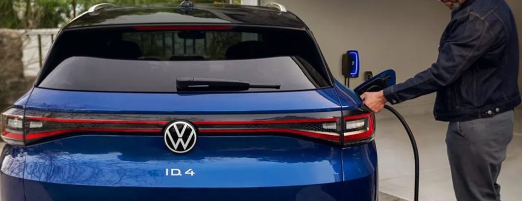 A man charging a VW ID.4 EV.