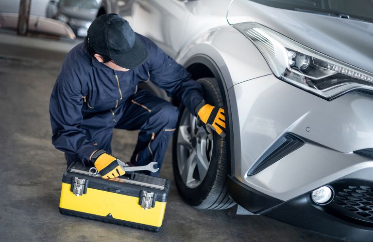 Technician checking the tire