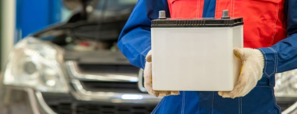 Technician holding a battery