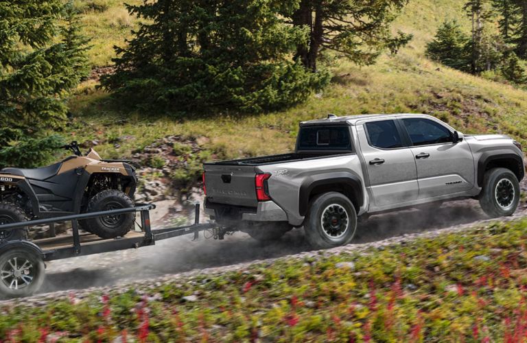 Toyota Tacoma towing an ATV