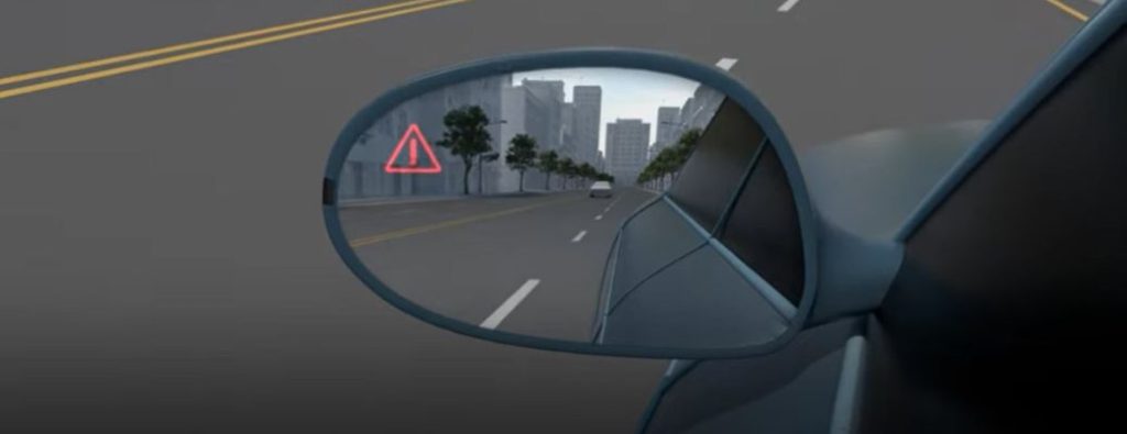 Kia blind-spot driver-assist technology on a side mirror