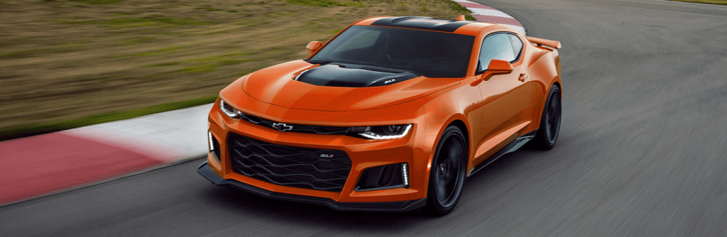 orange Chevrolet Camaro front view on a road